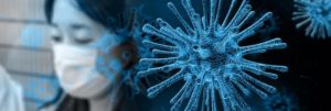 Coronavirusdarstellung vor Mensch mit Atemschutzmaske